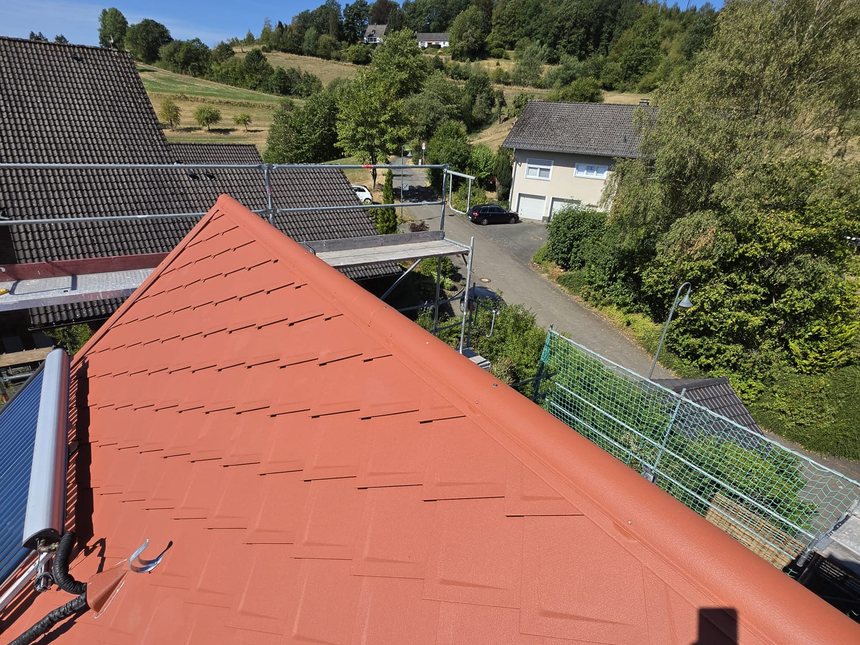 View across the newly covered roof surface with ridge finish